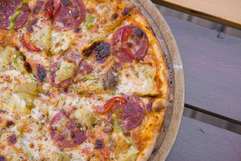 Mad Dog mod pizza with pepperoni and jalapeños