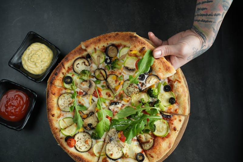 Fresh pizza being served at catering event